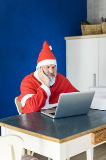 Frustrated Santa using laptop at home - MOEF00993