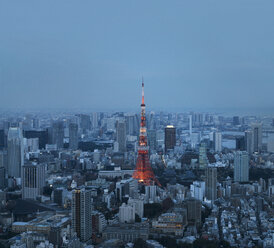 Aerial view of illuminated Tokyo Tower amidst cityscape at dusk - CAVF24883