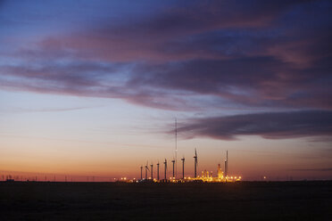 Illuminated power plant against cloudy sky at dusk - CAVF25018