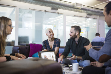 Coworkers planning while sitting in office - CAVF26224