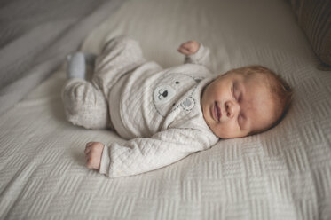 High angle view of baby boy sleeping on bed at home - CAVF26450