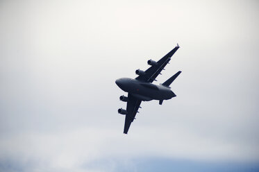 Low angle view of military airplane flying in sky - CAVF26516