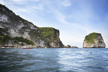 Rock formations at Nusa Penida Island against sky - CAVF26720