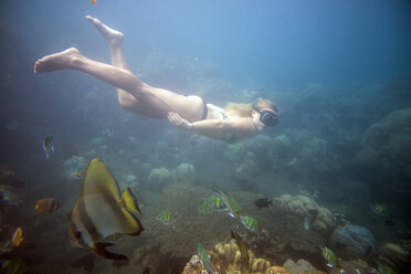 Full length of woman swimming in sea - CAVF26780
