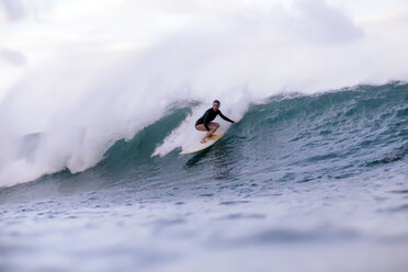 Full length of woman surfing in sea - CAVF26847