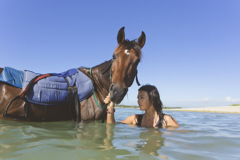 Indonesia, Bali, Woman with horse - KNTF01107