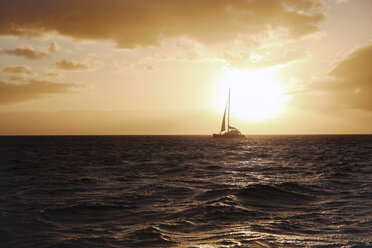 Boat sailing in sea against sky during sunset - CAVF27000