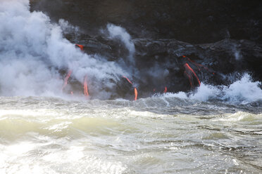 Steam emitting from lava rocks by sea - CAVF27027