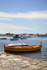 Boats moored on river against cloudy sky - CAVF27070