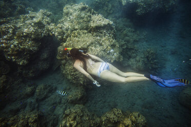 High angle view of woman snorkeling in sea - CAVF27097