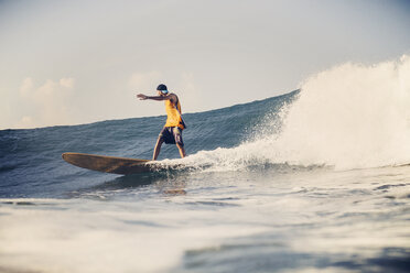 Low angle view of man surfing on sea against sky - CAVF27106