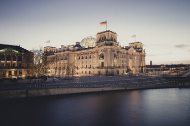 Germany, Berlin, Reichstag building at Spree river in the evening - STCF00495