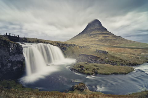 Iceland, Kirkjufellsfoss waterfall and Kirkjufell in the background stock photo