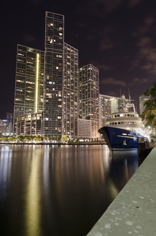 USA, Florida, Miami, High-rise buildings and luxury yacht at night stock photo