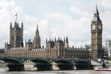 Westminster Bridge over Thames river by Big Ben against sky - CAVF27187