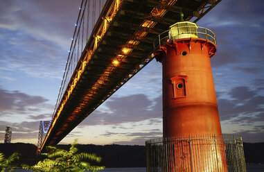 George Washington Bridge over red lighthouse at dusk - CAVF27221