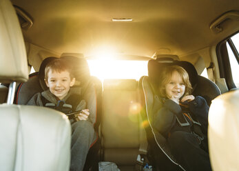 Portrait of boys sitting in car - CAVF27494