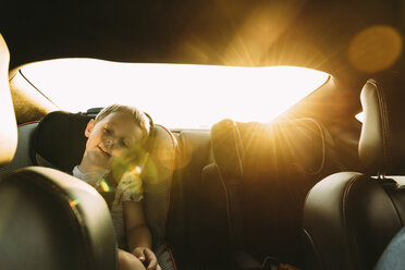 Boy relaxing while sitting in car - CAVF27514