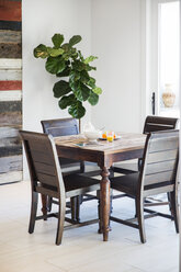 Wooden table and chairs at home - CAVF27569