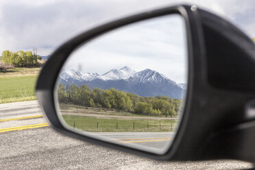 Reflection of snowcapped mountains on side-view mirror - CAVF27645