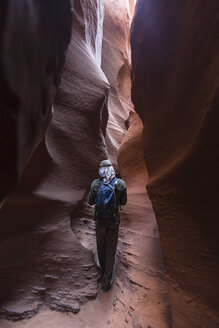 Low angle view of man rock climbing against mountain - CAVF27681