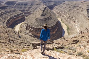 Rear view of woman standing on mountain - CAVF27689