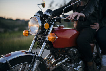 Close-up of young couple on motorcycle - CAVF27779