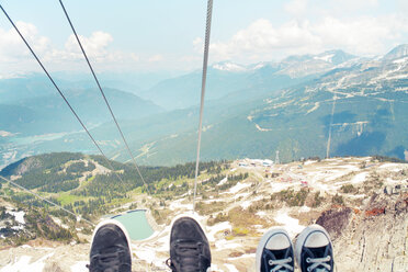 Low section of people wearing shoes over mountains - CAVF28098