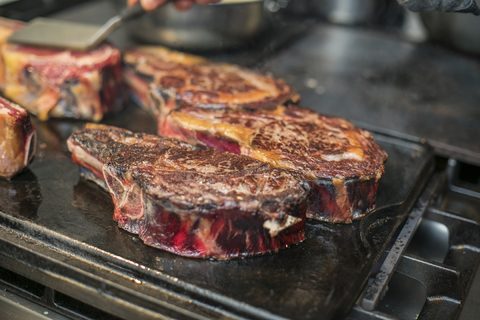 Meat is being grilled stock photo