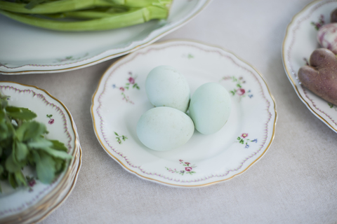 Green eggs on plate stock photo