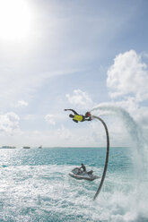 Maldives, man on flyboard above the sea - ZEF15251