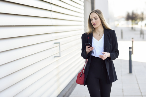 Portrait of businesswoman using cell phone stock photo