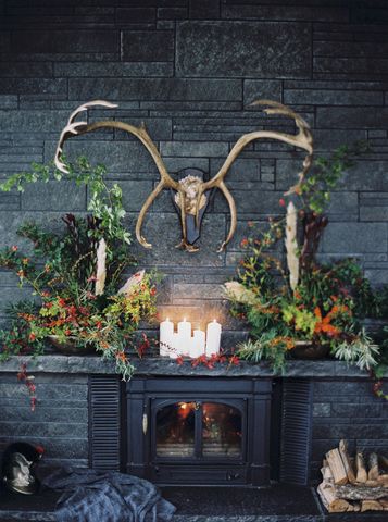 Antlers hanging over luxurious fireplace stock photo