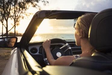 Woman in car by beach at sunset - FOLF00582