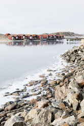 Wooden houses and rocky coastline in winter - FOLF00753