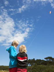 Two sisters flying kite - FOLF00780