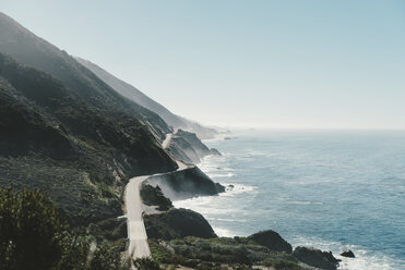 Rocky mountain by sea against clear blue sky - CAVF28624