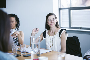 Business people working in board room at office - CAVF29000