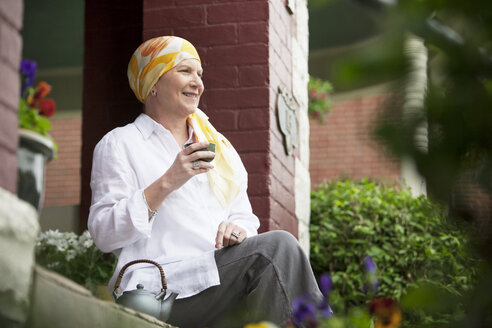 Happy mature woman drinking green tea - CAVF29247