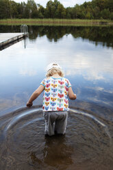 Girl standing in lake - FOLF01500