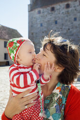 Mother kissing baby daughter - FOLF01535