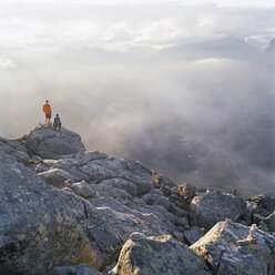 Hikers on Dalsnibba summit with Geiranger valley in background - FOLF01714