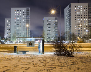 Bus stop by road at night - FOLF01847