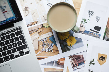 Cup of coffee and laptop on table - FOLF02223