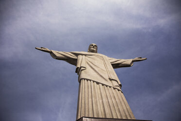 Low angle view of Christ the Redeemer against cloudy sky - CAVF29895