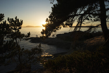 Silhouette father and son at Sucia Island during sunset - CAVF30070