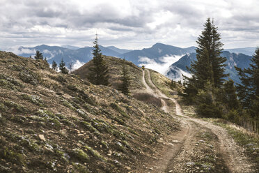 Road at mountains against cloudy sky - CAVF30124