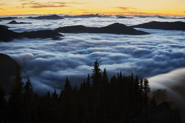 Majestic view of clouds covering mountains during sunset - CAVF30220