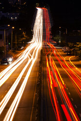 High angle view of light trails on road at night - CAVF30230