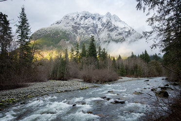 Scenic view of river and snowcapped mountain against sky - CAVF30267